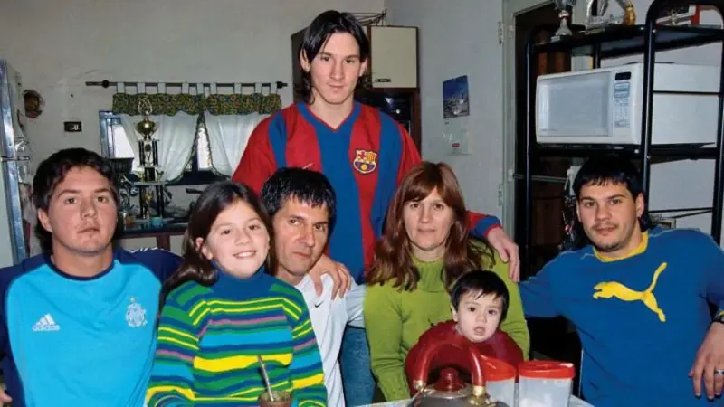 Lionel Messi poses with his brother Rodrigo, sister Maria Sol, father Jorge, mother Celia, nephew Tomas and brother Matias during a private photo session in October 2003