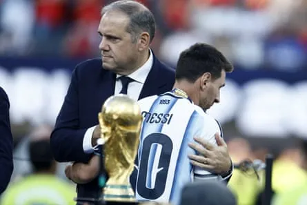Victor Montagliani consoles Lionel Messi after the World Cup final